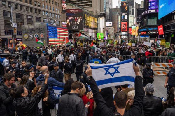 Demonstrators in support of the Palestinian people face pro-Israel counter-protesters in Times Square on October 8, 2023 in New York City.