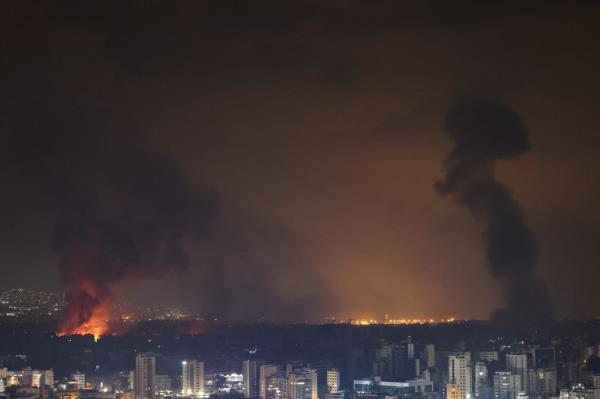 Smoke and flames rise in Beirut's southern suburbs, after Israeli air strikes, amid ongoing hostilities between Hezbollah and Israeli forces,