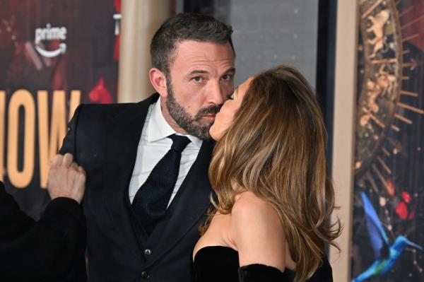 Jennifer Lopez and Ben Affleck share a kiss at "This is Me... Now: A Love Story" premiere in February 2024.
