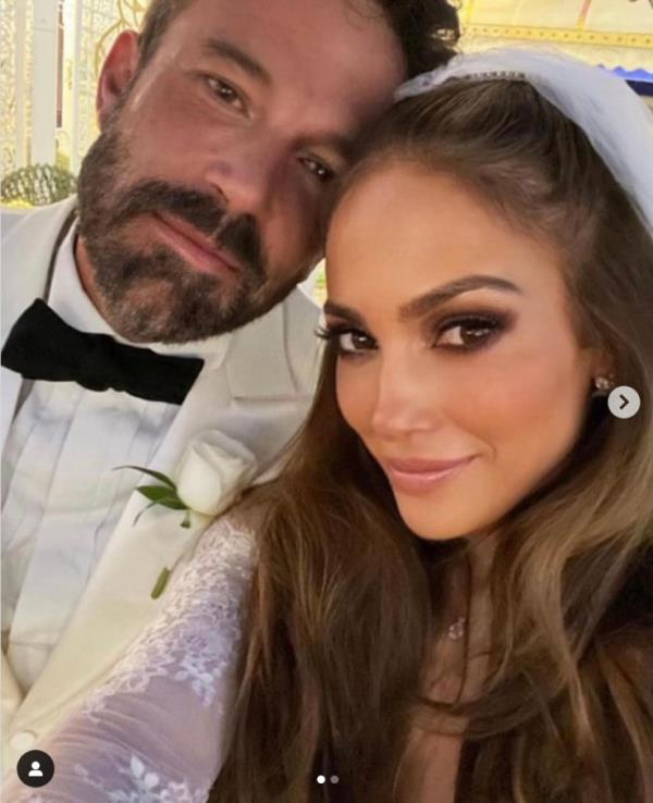 Ben Affleck and Jennifer Lopez take a wedding selfie.